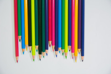 set of wooden color pencils with different lengths with Downside frontal view on white background