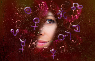 Astrological symbols and zodiac signs and planets on a wall background.