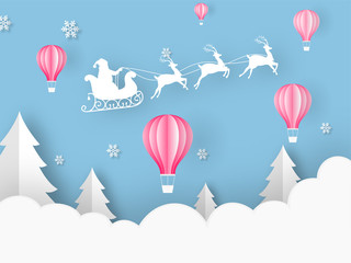 Paper cut style hot air balloons, Xmas tree, snowflakes and silhouette santa riding reindeer sleigh on cloudy blue background for Merry Christmas celebration.