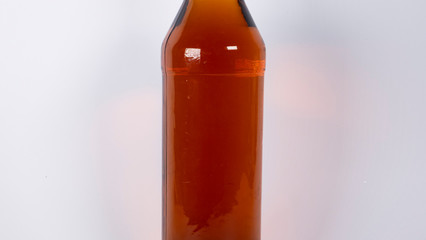 Bottle with cognac, whiskey on a white background