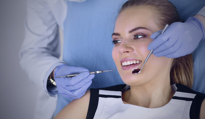 beautiful girl in the dental chair on the examination at the de