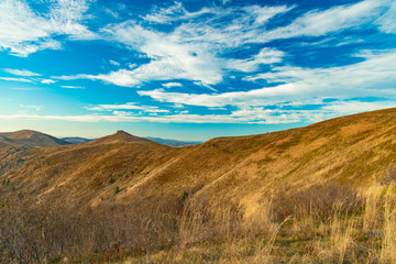 Carpathian mountain ridge scenery landscape view trekking route in clear weather day time and vivid blue sky cloudscape background 