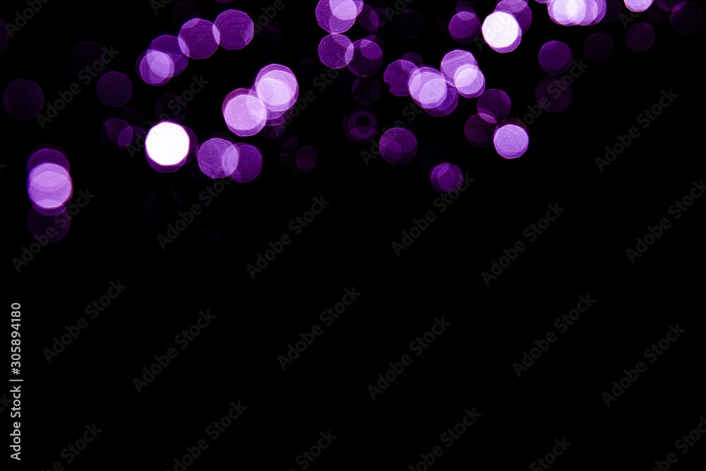 Wall mural Abstract background purple bokeh with black background.