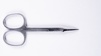 Iron scissors for manicure on a white background