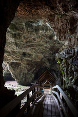 A wooden bridge at the entrance of Smoo Cave, a large combined sea cave and freshwater cave in Durness in Sutherland, Highland, Scotland, UK.