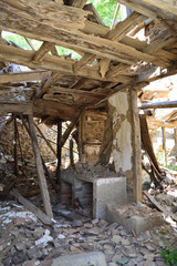 Fototapeta na wymiar Ruined house in the abandoned Greek village Derekoy (Schinoudi) - turkish aegean island Gokceada