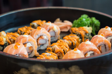 Sushi salmon roll with sauce, Japanese food