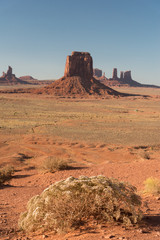 Fototapeta premium The wide countryside in Monument Valley. An afternoon view of Navajo Nation with the mesas at the back