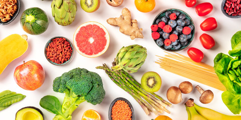 Vegan food panorama. Healthy diet concept. Fruits, vegetables, pasta, nuts, legumes, mushrooms,...