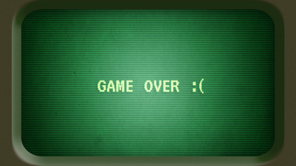 Game over message with sad face on old green computer terminal screen with frame - 305898312