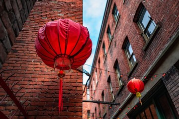Low angle shot of Chinese lanterns in Fan Tan Alley, Chinatown, Victoria, BC Canada