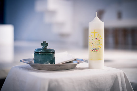 Close up on ceramic jar containing Holy Spirit oil before baptism ceremony 