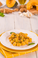 Pumpkin gnocchi with grated amaretti cookies.	