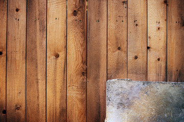 Wooden background with metal plate