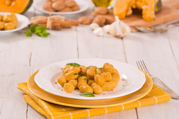 Pumpkin gnocchi with grated amaretti cookies.	