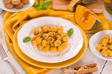Pumpkin gnocchi with grated amaretti cookies.	
