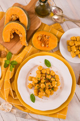 Pumpkin gnocchi with grated amaretti cookies.	