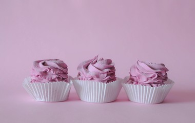 Homemade marshmallow berry zephyr on pink background