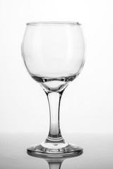 Empty glass of wine isolated on white background.