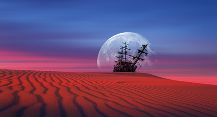 Silhouette of old ship in the desert at amazing sunset 