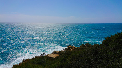 Beautiful azure sea and the rocky beach