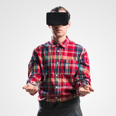 Guy in mask experiencing virtual reality as new entertainment device