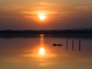 Naklejka premium Sunset, setting sun, water reflection over Salt Lake in Larnaca, Cyprus