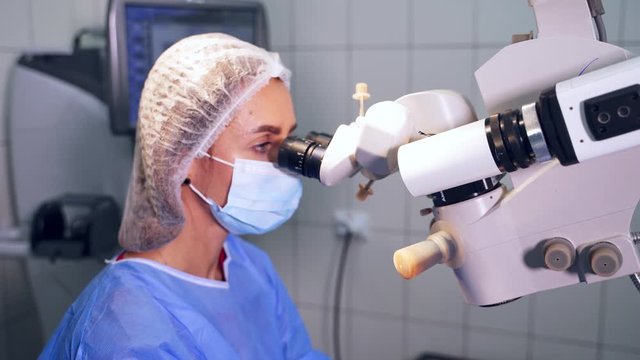 Ophthalmology laser operation. Surgeon in the operating room during ophthalmic surgery