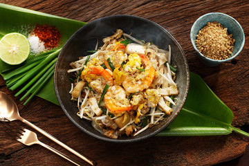Thai traditional food: Still life of Pad Thai, stired noodles with shrimps, egg served with...