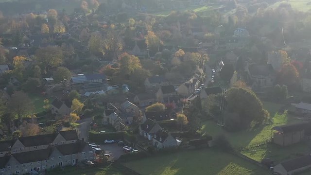 Telephoto aerial view of Longborough, a small village near Moreton-In-Marsh in the Cotswolds Area Of Outstanding Natural Beauty, UK
