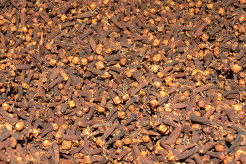 Dried cloves spicy background. Top view. Food background. Carnation grains. 