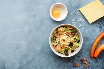 Carbonara paste. Spaghetti with bacon, meatballs, zucchini, sauce and spices