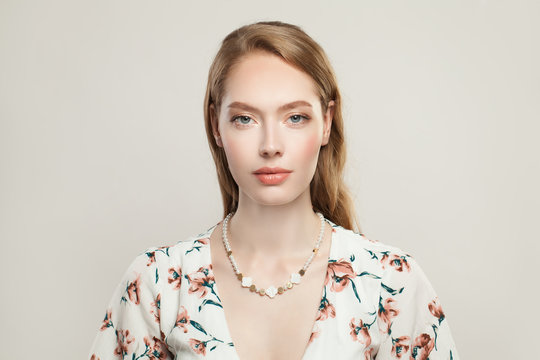 Jewelry Woman Fashion Model Wearing Luxurious Necklace With Pearls, Nacre And Golden Beads On White Background