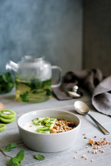 Buckwheat granola with yogurt and kiwi. Nutritious healthy breakfast
