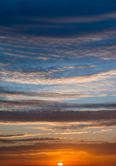 Fantastic clouds at sunrise, vertical panorama