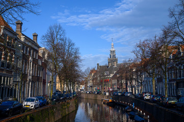 Canal in Gouda, the Netherlands (Europe), overlooking the tower of the Sint Janskerk.