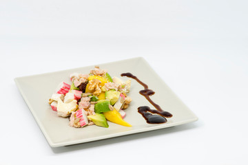 salad with avocado, mango, tuna, goat cheese, raisin crab sticks and salted pipes with modena vinegar. Healthy and balanced diet