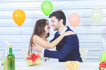 Couple enjoy in romantic party with hapiness face when open gift box celebrating new and christmas party decorated by christmas theme valentine woman day concept.