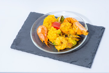 Yellow rice with shrimp, fish and vegetables