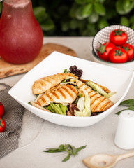 chicken salad with lettuce and corn in white ceramic bowl