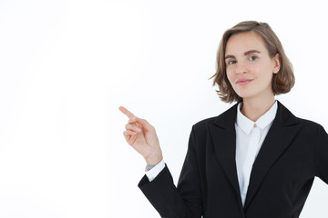 A beautiful business woman in a suit pointed her hand to the right side with a happy face on a white background in the concept of business success and career progress. Presenter.