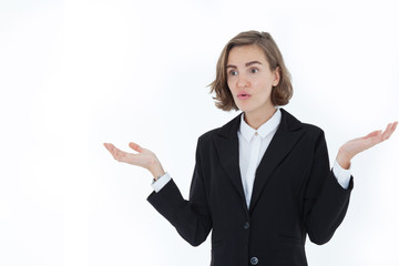 A beautiful business woman wearing a suit is disgruntled and angry, with both hands raised against the white background in the concept of business Bad news. Trade war. Slow down of world economic.