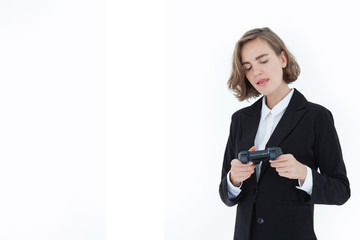 Beautiful business women wearing suit is playing games in a cheerful, happy manner. Relaxing from working on a white background with concept of business success and relaxation from work.