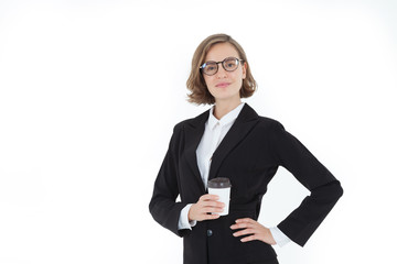 A businesswoman wearing a suit and glasses, holding a coffee cup, a happy face on a white background in the concept of business success and career progress