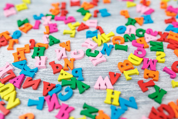 colored wooden letters on gray wooden background