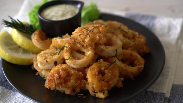 fried squids or octopus (calamari) with sauce