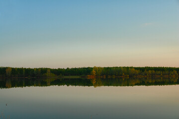 Large lake or river in good Sunny calm weather. Evening on the lake