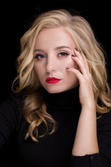 Naklejka premium Beautiful girl, portrait with hands on a black background. Beauty photo. Makeup