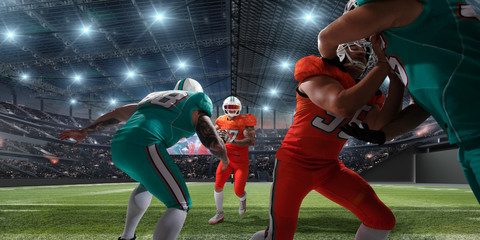 American football players in professional sport stadium.