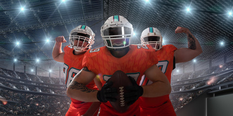 American football players in professional sport stadium.